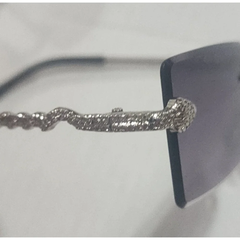 Womens silver snake embellished rimless fashionable sunglasses uv protection